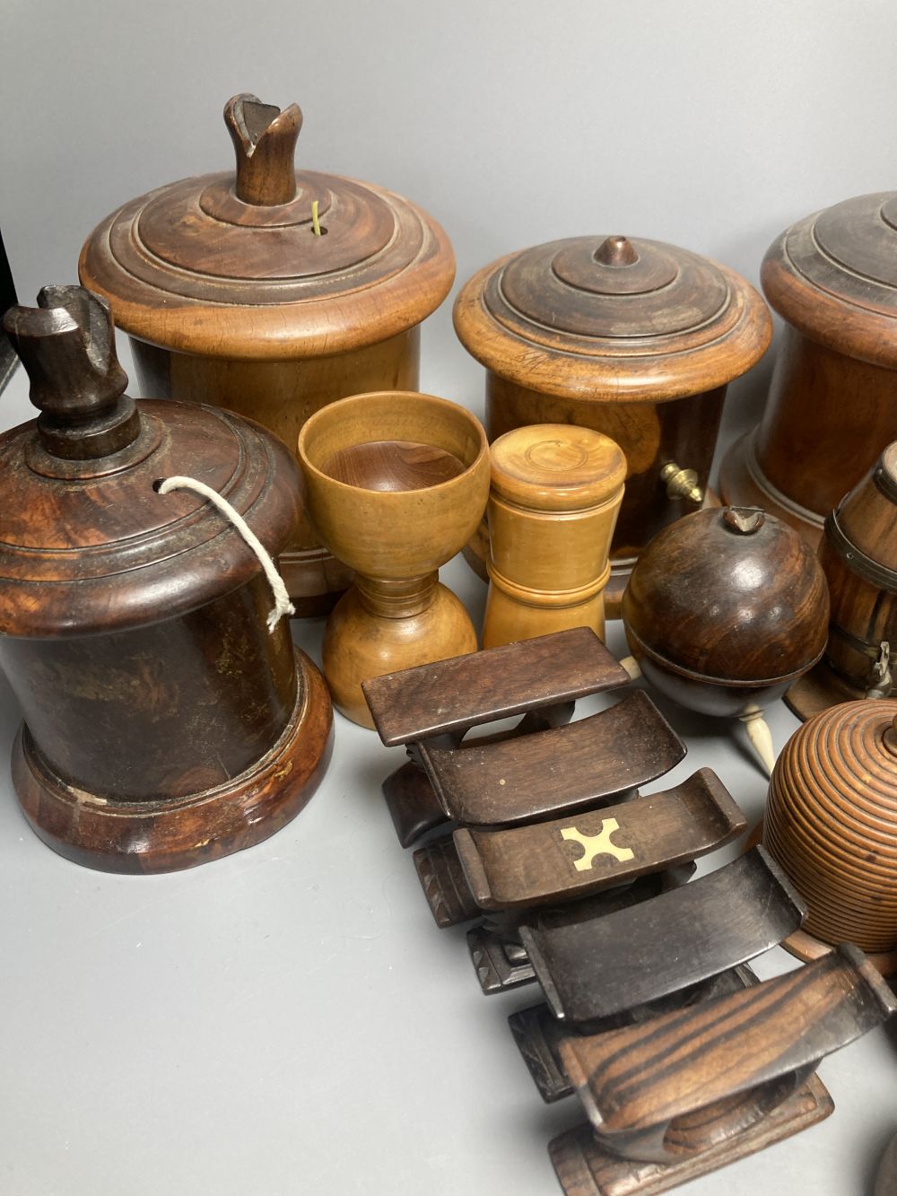 Five lignum vitae string dispensers, other treen ornaments, a parquetry box etc.